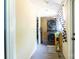 Functional laundry room features stacked washer and dryer with storage and natural light at 3419 Boat Club Rd, Belmont, NC 28012