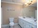 Bright bathroom with a dual sink vanity, tile flooring, and updated fixtures at 402 Scotland Dr, Kings Mountain, NC 28086