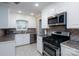 Modern kitchen with stainless steel appliances and ample cabinet space at 402 Scotland Dr, Kings Mountain, NC 28086