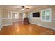 Bright living room with hardwood floors and a comfortable armchair at 402 Scotland Dr, Kings Mountain, NC 28086