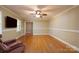 Spacious living room with hardwood floors, ceiling fan, and natural light at 402 Scotland Dr, Kings Mountain, NC 28086