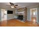Cozy living room featuring a brick fireplace and hardwood floors at 402 Scotland Dr, Kings Mountain, NC 28086