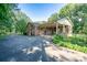Brick home featuring a covered patio and a spacious driveway at 402 Scotland Dr, Kings Mountain, NC 28086