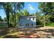 Back of home with blue siding and many windows at 411 Patience Dr, Concord, NC 28025