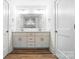 Modern bathroom featuring a double vanity with ample cabinet space and a large mirror at 411 Patience Dr, Concord, NC 28025