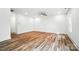 Spacious bedroom with wood-look flooring, neutral paint and ceiling fan at 411 Patience Dr, Concord, NC 28025