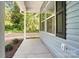 The inviting front porch showcasing the home's exterior with blue siding and black shutters at 411 Patience Dr, Concord, NC 28025