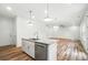 A functional island has a sink, a dishwasher, and granite countertops at 411 Patience Dr, Concord, NC 28025