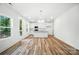 Bright, open kitchen features white cabinets, granite countertops, and stainless steel appliances at 411 Patience Dr, Concord, NC 28025