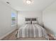 Comfortable bedroom with neutral tones, plush carpet, and a window offering pleasant natural light at 507 Yucatan Dr # 71, Waxhaw, NC 28173