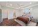 This main bedroom boasts wood floors, natural light, and en suite bathroom with a glass shower enclosure at 507 Yucatan Dr # 71, Waxhaw, NC 28173