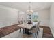 Open dining room with marble table, wainscoting, and ample natural light at 507 Yucatan Dr # 71, Waxhaw, NC 28173