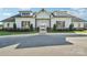 Charming clubhouse showcasing an inviting entrance, symmetrical design, and manicured landscaping at 507 Yucatan Dr # 71, Waxhaw, NC 28173