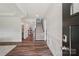 Elegant home foyer featuring hardwood floors, white trim, a staircase, and lots of natural light at 507 Yucatan Dr # 71, Waxhaw, NC 28173
