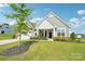 Charming single-Gathering home with manicured lawn, two-car garage, covered entrance, and beautiful landscaping at 507 Yucatan Dr # 71, Waxhaw, NC 28173