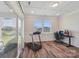 Bright home gym/flex room with hardwood floors, natural light, and access to outdoor patio at 507 Yucatan Dr # 71, Waxhaw, NC 28173