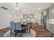 Kitchen area featuring gray cabinets, island, pendant lights, and stainless steel appliances at 507 Yucatan Dr # 71, Waxhaw, NC 28173
