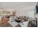 Open-concept living room with a fireplace, hardwood floors, and a seamless flow to the kitchen at 507 Yucatan Dr # 71, Waxhaw, NC 28173