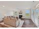 Bright living room with a fireplace, hardwood floors, and comfortable seating, perfect for relaxation at 507 Yucatan Dr # 71, Waxhaw, NC 28173