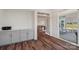 Office area with built-in gray cabinets and access to screened porch and living room at 507 Yucatan Dr # 71, Waxhaw, NC 28173