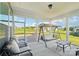 Covered patio with outdoor seating, swing, and views of the landscaped backyard at 507 Yucatan Dr # 71, Waxhaw, NC 28173