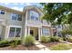 Inviting townhouse facade with stone accents, a covered porch, and manicured landscaping at 514 Bent Leaf Ct, Fort Mill, SC 29708