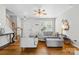 Inviting living room with hardwood floors, modern furniture, and an abundance of natural light at 514 Bent Leaf Ct, Fort Mill, SC 29708