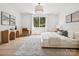 Bright bedroom with a large window, hardwood floors and decorative furnishings at 5311 Carmel Park Dr, Charlotte, NC 28211