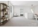 Open bonus room featuring an open doorway, light neutral colors, and natural light at 5311 Carmel Park Dr, Charlotte, NC 28211