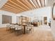 A modern dining room features an ornate ceiling and a view of the kitchen at 5311 Carmel Park Dr, Charlotte, NC 28211