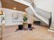 Grand foyer showcasing a striking staircase, hardwood floors, and elegant decor at 5311 Carmel Park Dr, Charlotte, NC 28211