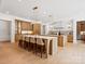 Bright, modern kitchen with an eat-in island, sleek counters, and premium cabinetry at 5311 Carmel Park Dr, Charlotte, NC 28211