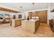 Modern kitchen with an oversized island, hardwood cabinets, and stainless steel appliances at 5311 Carmel Park Dr, Charlotte, NC 28211