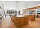 Spacious, contemporary kitchen featuring marble counters, hardwood cabinets, and an open layout at 5311 Carmel Park Dr, Charlotte, NC 28211