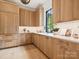 Cozy kitchen showcasing custom cabinets, a sleek countertop, and modern fixtures at 5311 Carmel Park Dr, Charlotte, NC 28211