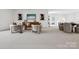 Living room featuring stylish decor, cozy seating arrangements, and lots of open space at 5311 Carmel Park Dr, Charlotte, NC 28211