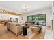 Spacious living room with hardwood floors, designer lighting, and sliding glass doors to the outdoor patio at 5311 Carmel Park Dr, Charlotte, NC 28211