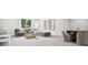 Cozy living room with comfortable seating, a large window, and stylish decor for a relaxed atmosphere at 5311 Carmel Park Dr, Charlotte, NC 28211