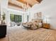 Luxurious main bedroom with high ceilings, wooden beams, plush carpet, and lots of natural light at 5311 Carmel Park Dr, Charlotte, NC 28211
