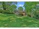 Beautiful brick home and landscaped backyard on a lush green lawn at 5441 Wintercrest Ln, Charlotte, NC 28209