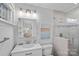 Bright bathroom features modern vanity with granite countertop, framed mirror, and a glass enclosed tiled shower at 5441 Wintercrest Ln, Charlotte, NC 28209