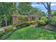 Charming home with landscaped yard and mature trees at 5441 Wintercrest Ln, Charlotte, NC 28209