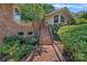 Brick pathway leading to front door with landscaped yard at 5441 Wintercrest Ln, Charlotte, NC 28209