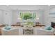 Bright living room features large bay window, neutral furniture, and hardwood floors at 5441 Wintercrest Ln, Charlotte, NC 28209