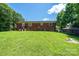 Large backyard features a well-maintained lawn and fenced perimeter at 559 15Th Se Ave, Hickory, NC 28602