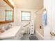 Bathroom featuring a modern vanity, tub, and patterned tile flooring at 559 15Th Se Ave, Hickory, NC 28602