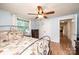 Bedroom featuring laminate wood floor, closet, and ceiling fan with light fixture at 559 15Th Se Ave, Hickory, NC 28602