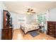 Bedroom featuring hardwood floors, ceiling fan, and lots of light from multiple windows at 559 15Th Se Ave, Hickory, NC 28602