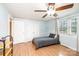 Bedroom with laminate wood flooring, ceiling fan, large closets and a double window at 559 15Th Se Ave, Hickory, NC 28602