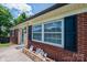 Exterior elevation showing brick facade, dark trim, and an inviting entrance with charming details at 559 15Th Se Ave, Hickory, NC 28602